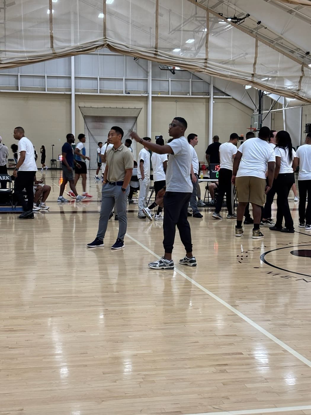 Clinicians leading on-court instruction at a JD80 camp